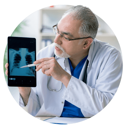 young white female doctor checking patient data on tablet