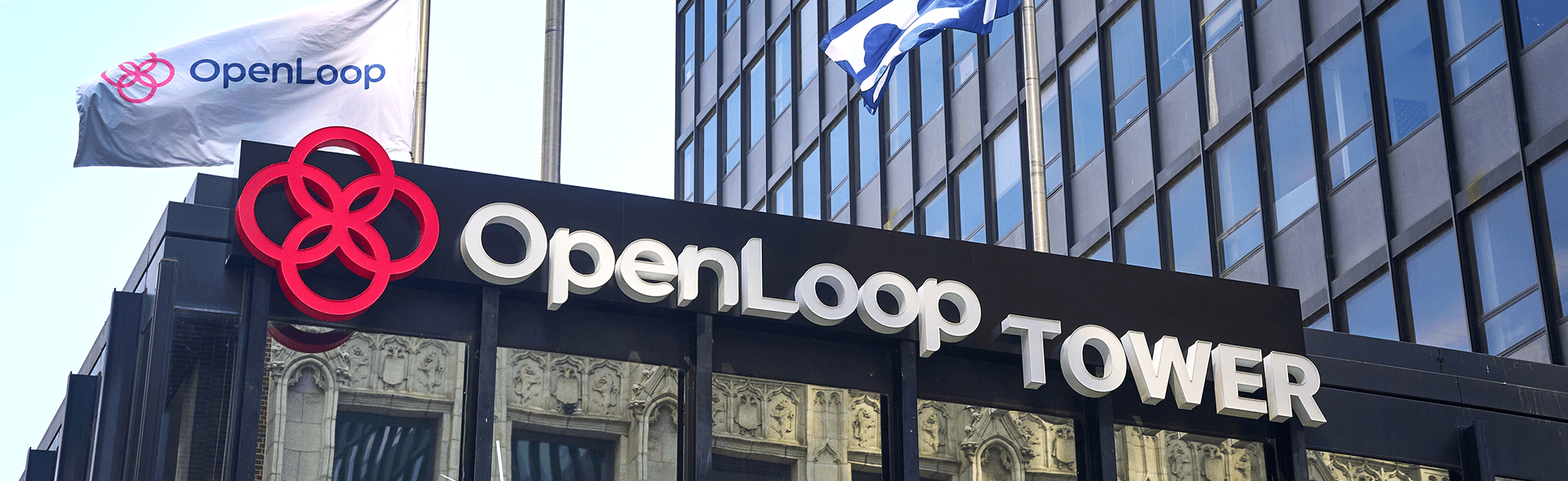 An image of the OpenLoop Tower building sign at OpenLoop's headquarters in downtown Des Moines, Iowa